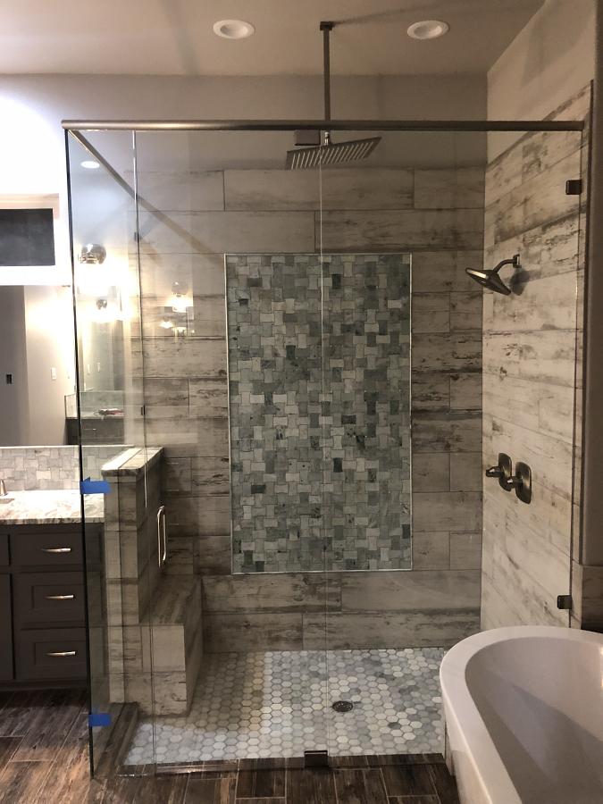 Example of pivoting glass shower door by Weatherford Glass